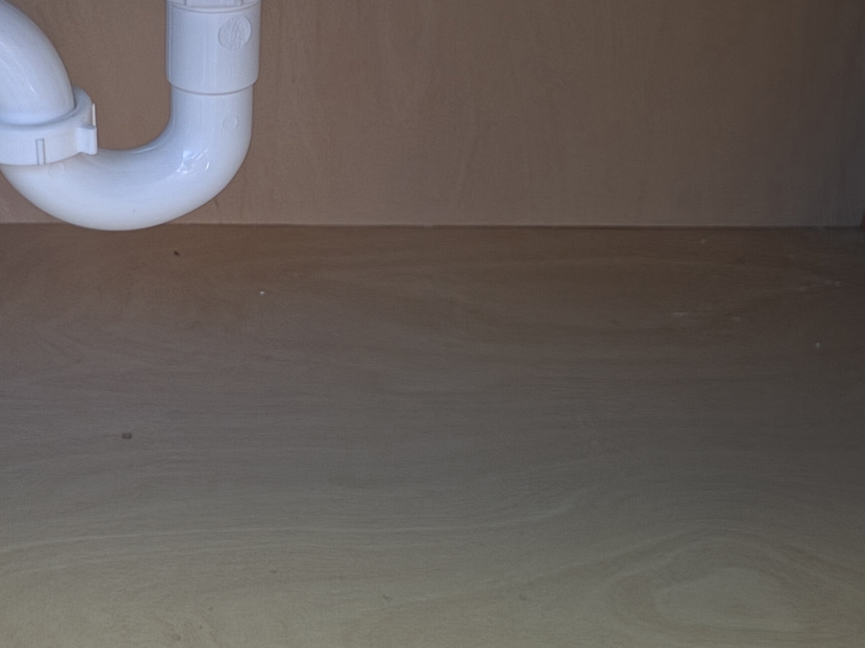 Clean and structurally restored under-sink cabinet following mold remediation and sanitation by Certified Mold Removal in Manalapan.